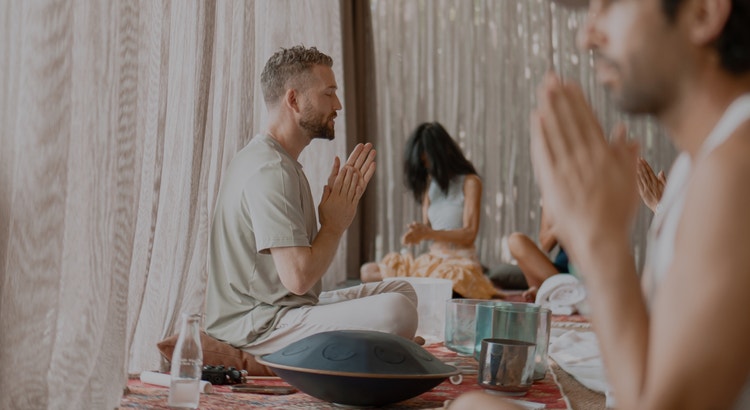 Group meditation session in serene setting.