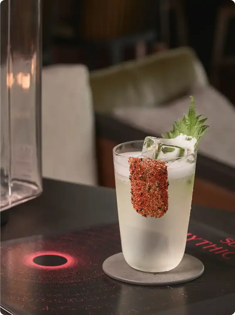 Leaf and spice garnish crown cocktail.