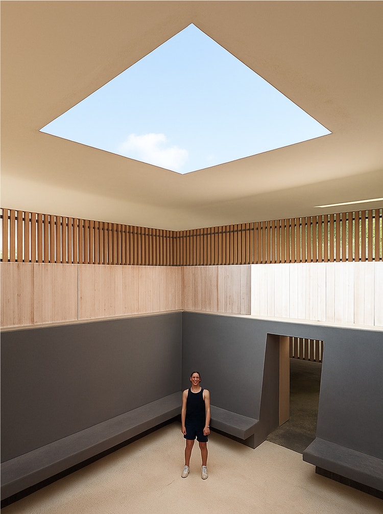 A minimalist concrete room with skylight opening